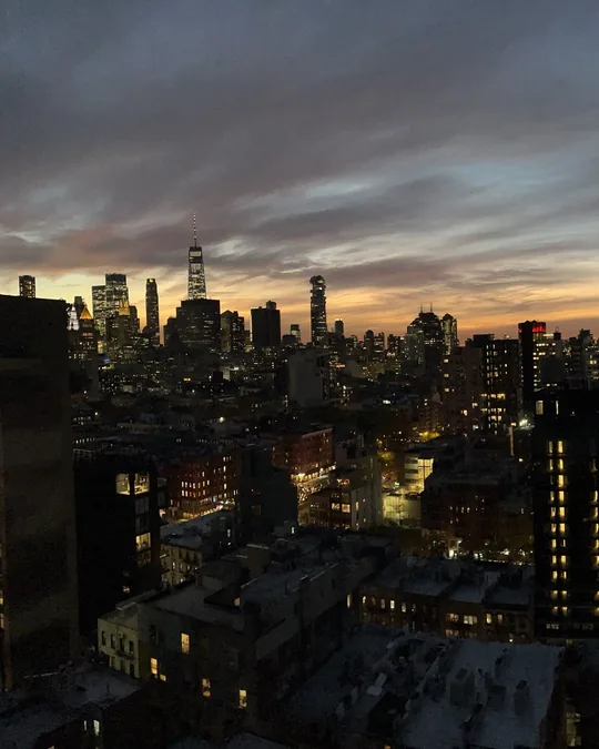 Slide 1: One World Trade Center against the sunset.
